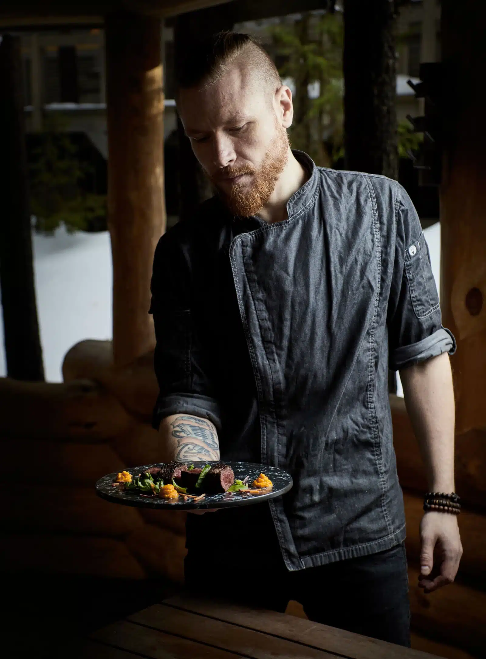 Chef holding plate Dominic Scott