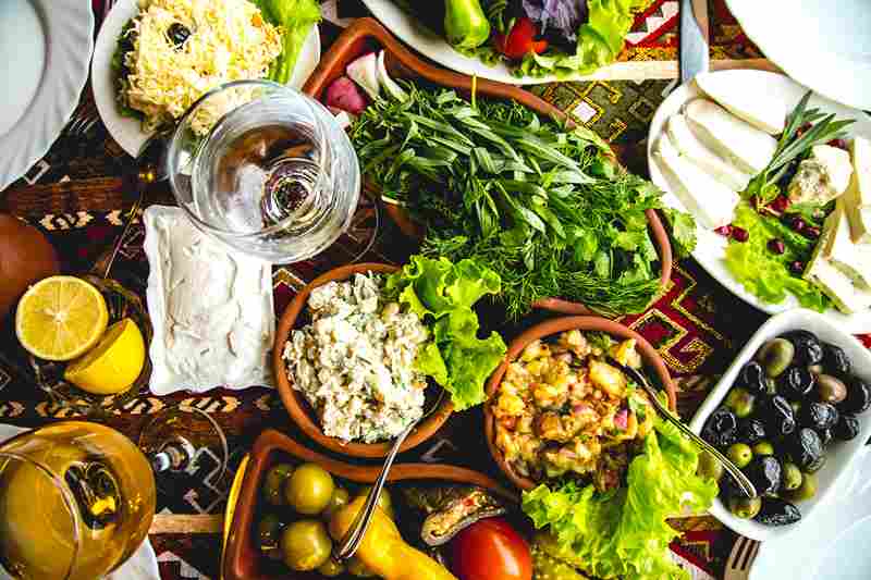 a table with a Mediterranean potluck dish placed